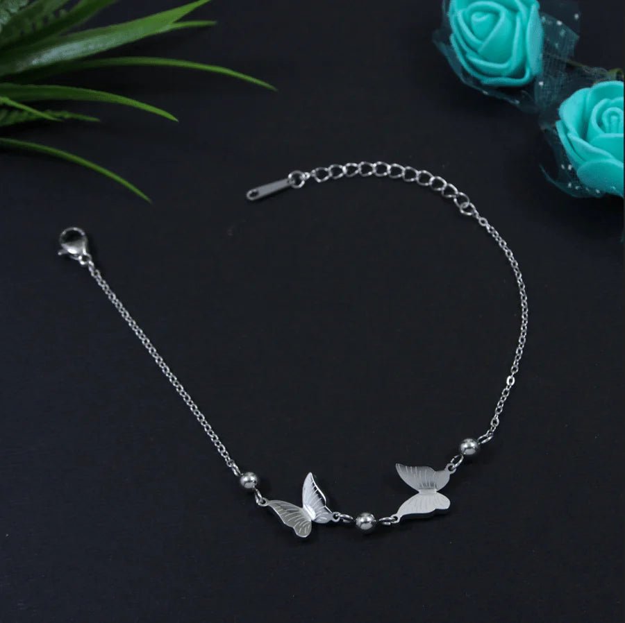Beruzu - Silver Finish Bracelet with Metal Ball and Butterfly Accents
