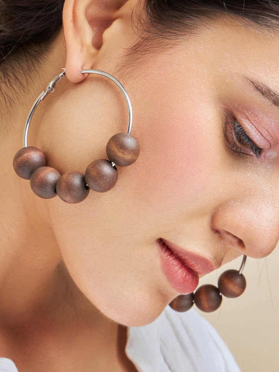 Beruzu - Silver Finish Hoop Earrings with Saturn-Like Wooden Beads