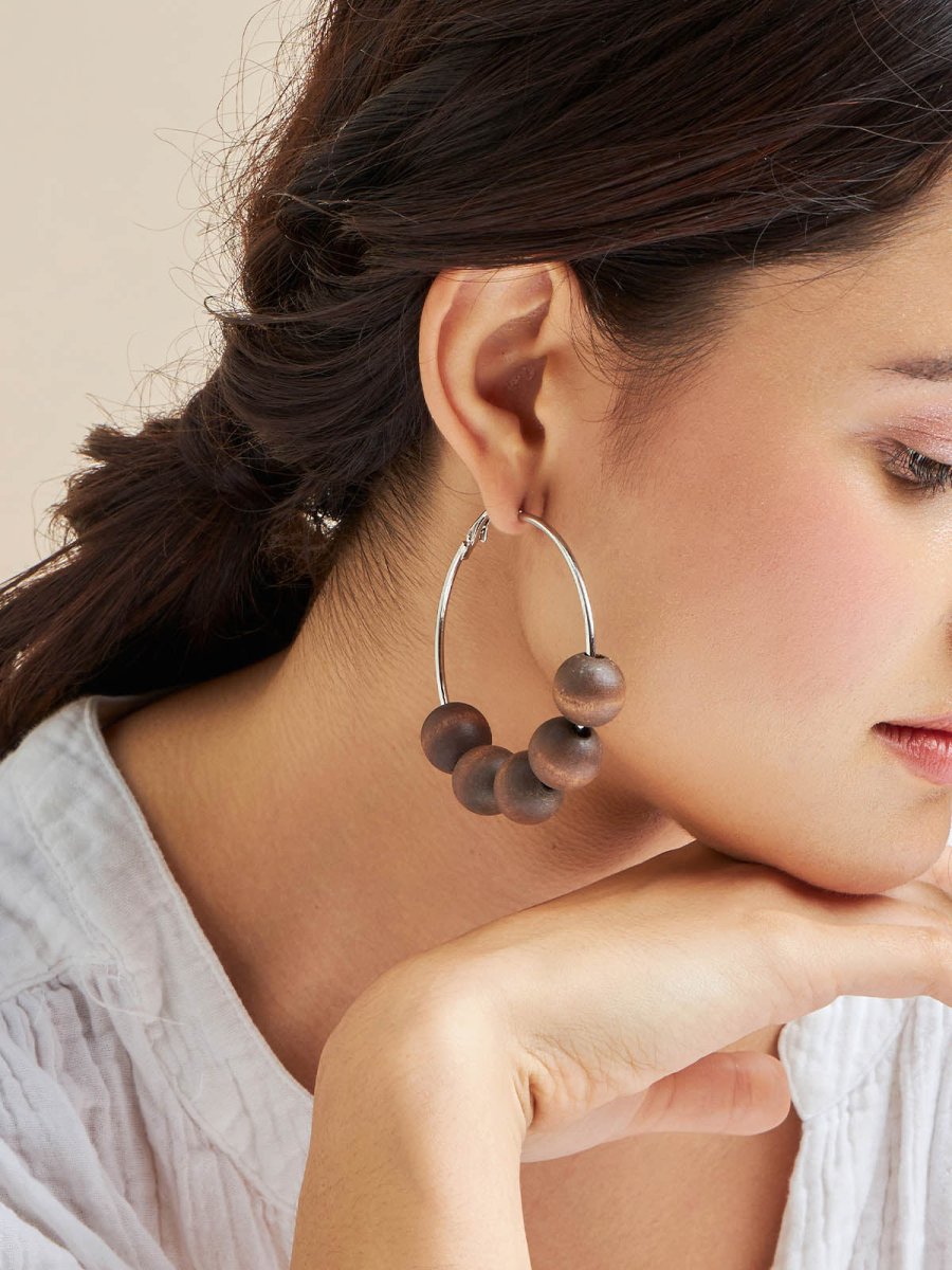 Beruzu - Silver Finish Hoop Earrings with Saturn-Like Wooden Beads