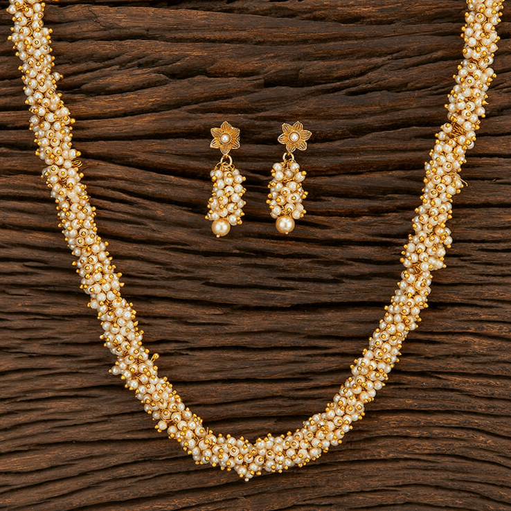 Beruzu - Intricately Handcrafted Gold - Plated Pearl Cluster Necklace with Floral Drop Earrings - Beruzu