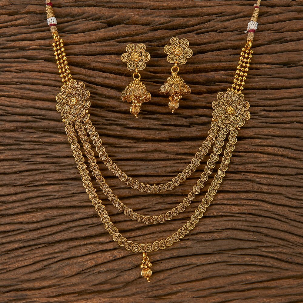 Beruzu - Multi - Strand Gold - Plated Necklace Set with Floral Motifs and Intricate Jhumka Earrings - Beruzu