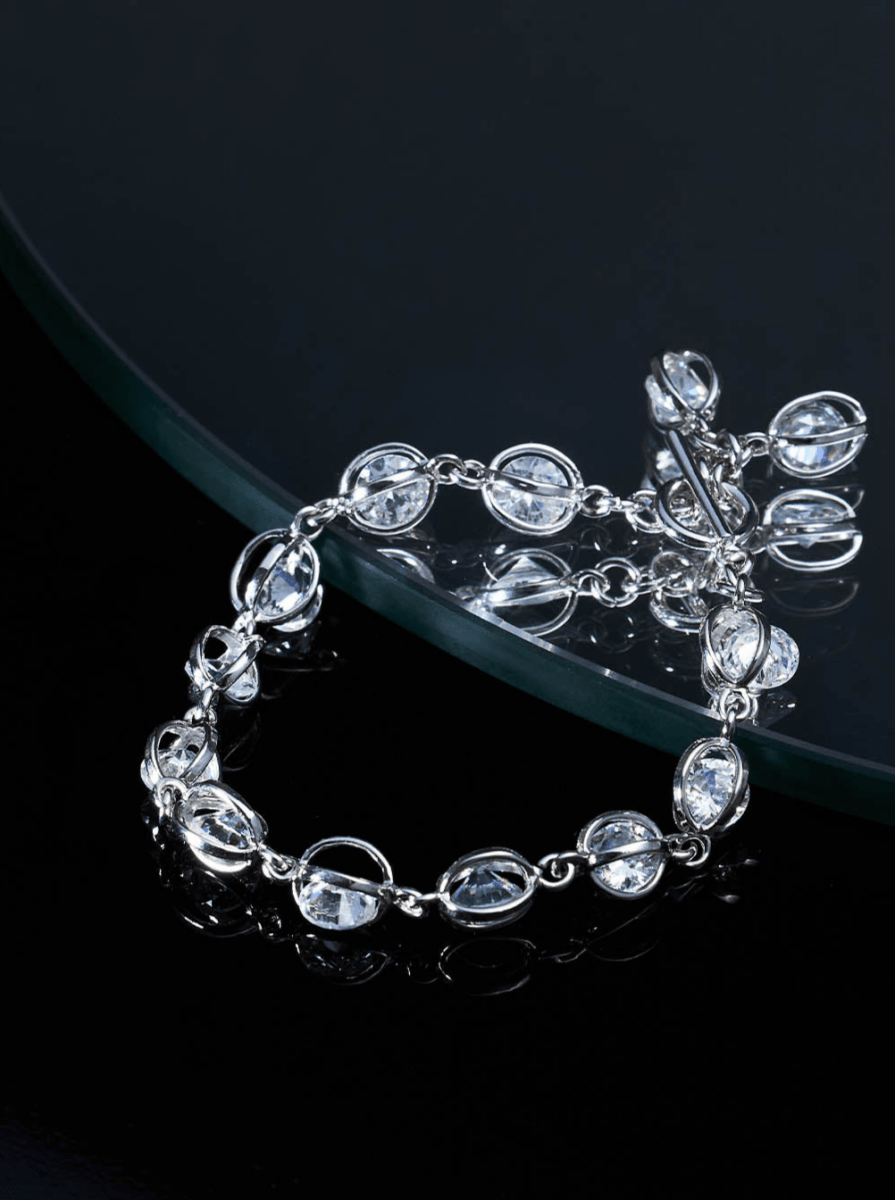 Beruzu - Silver Plated Oval Loop Bracelet with Embedded Stone Accents